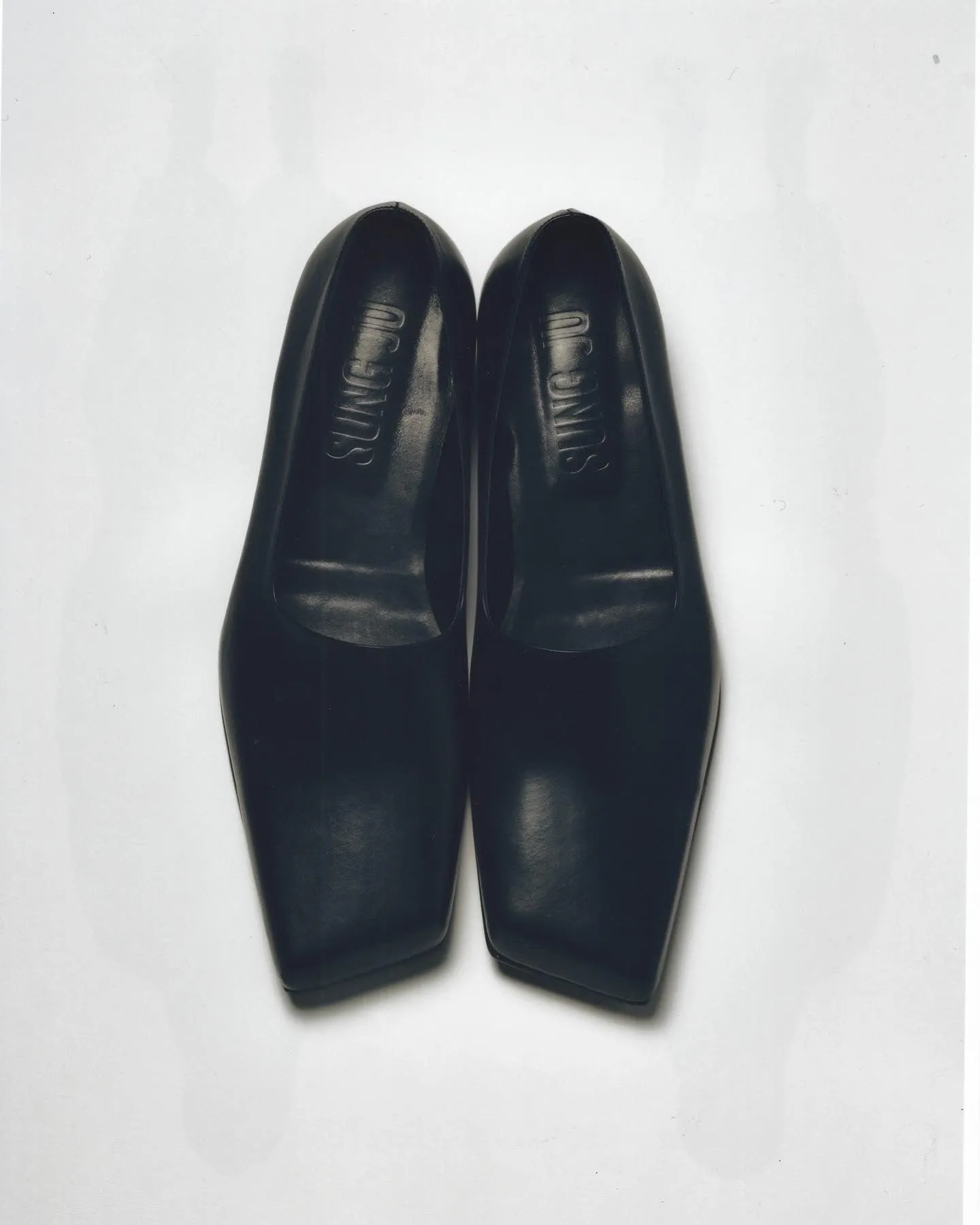 black slashed loafers