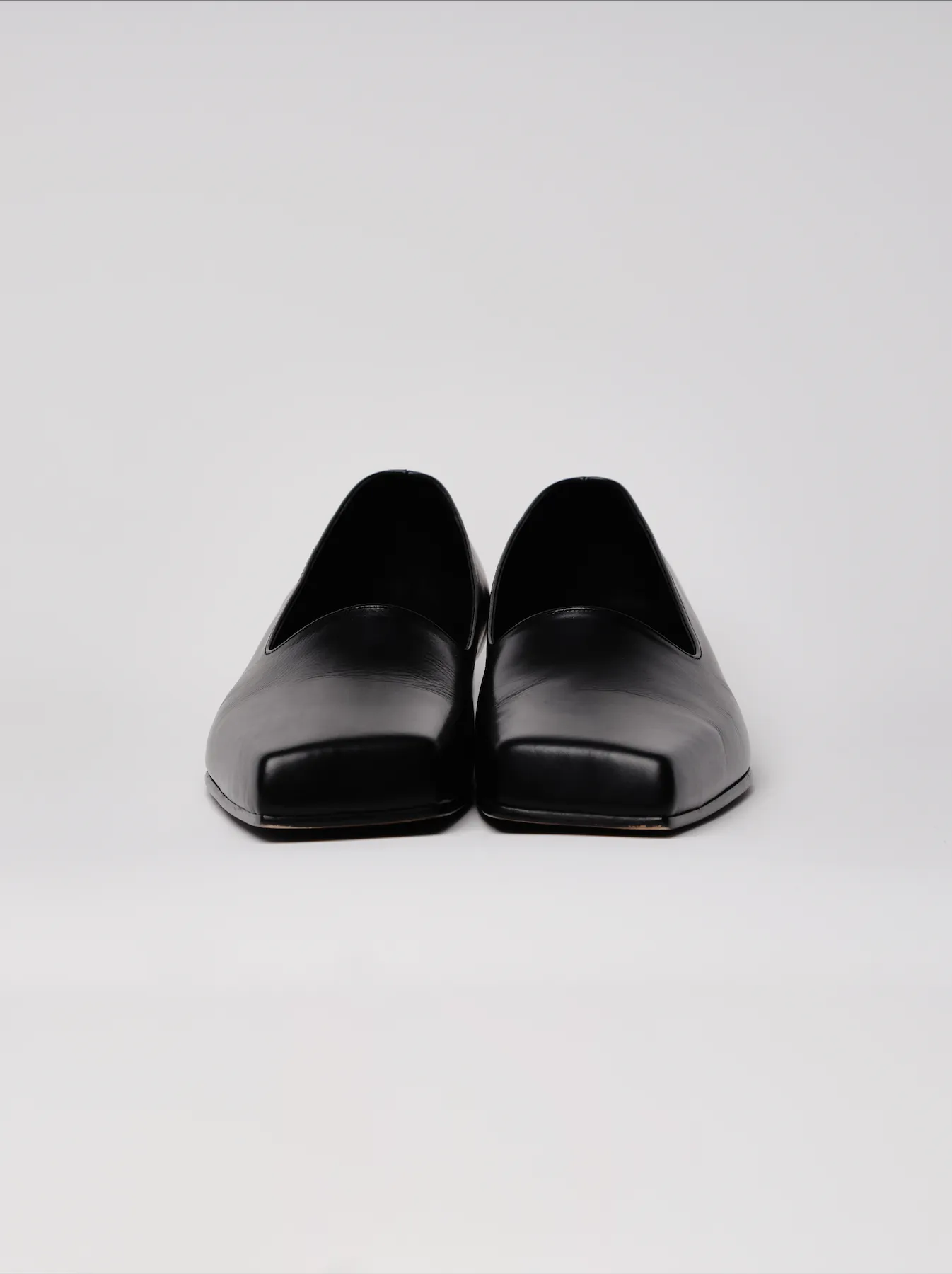 black slashed loafers